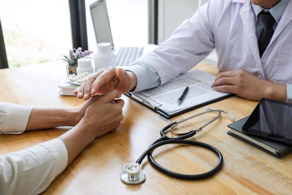 Professional handshake between AV Chemist representative and attorney establishing partnership for personal injury pharmacy services