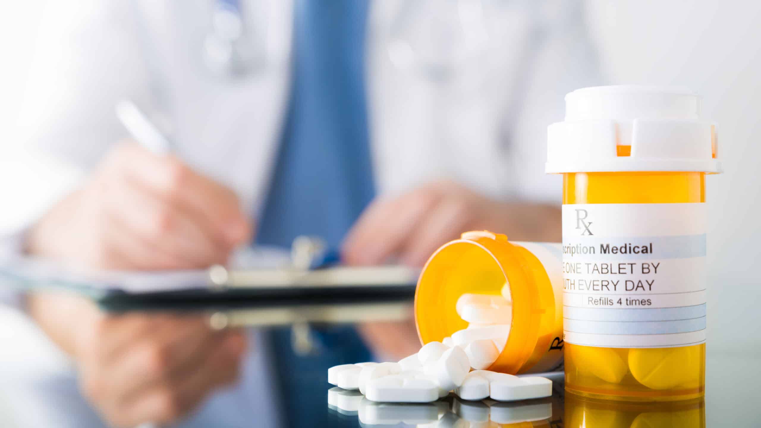 Pharmacist preparing emergency prescription medication for night delivery service