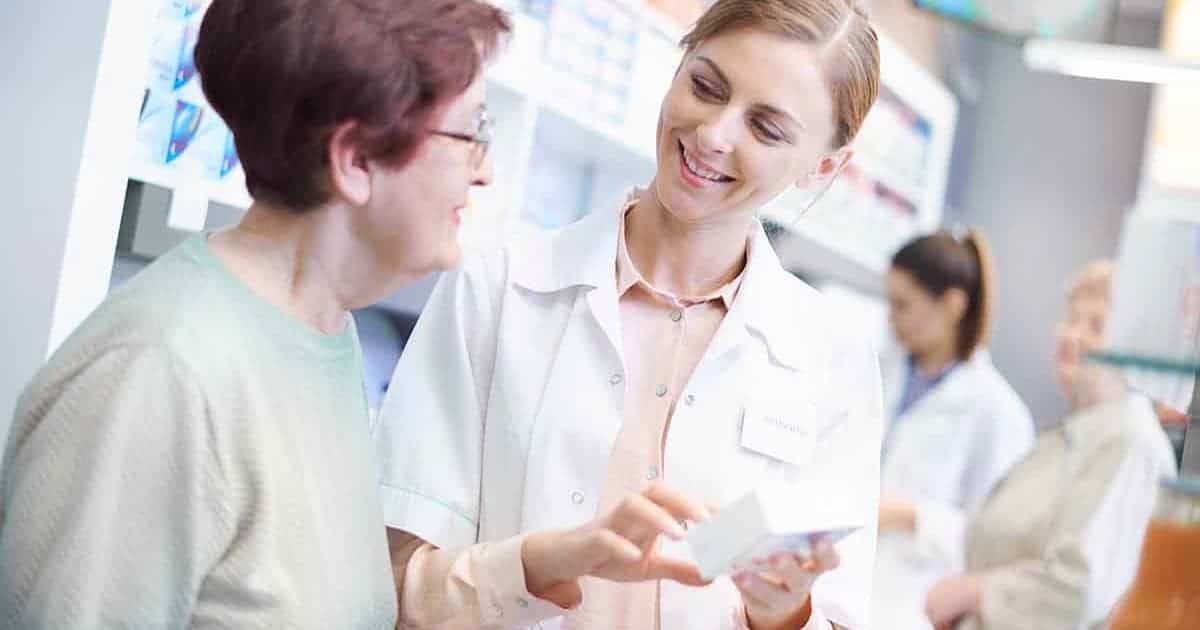 Pharmacist consulting with patient about allergen-free medication options